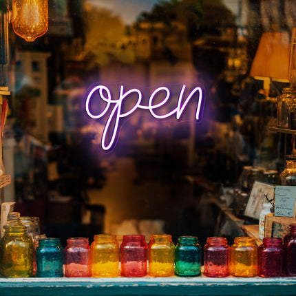 Vintage purple neon "Open" sign