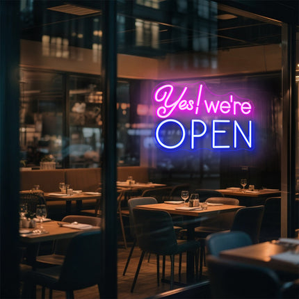 Pink & blue Yes! We're Open Neon Sign