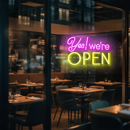 Pink & yellow Yes! We're Open Neon Sign