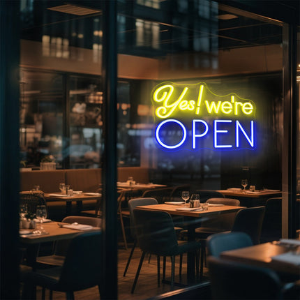 Yellow & blue Yes! We're Open Neon Sign